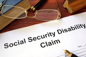 Social security claim document on a desk.