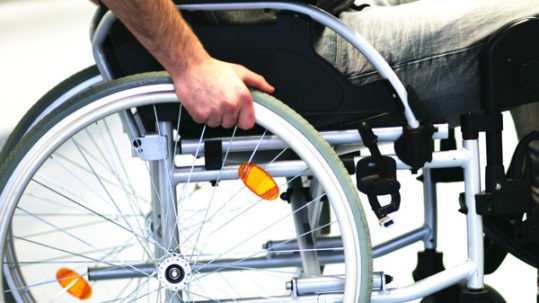 Man sitting in a wheelchair.