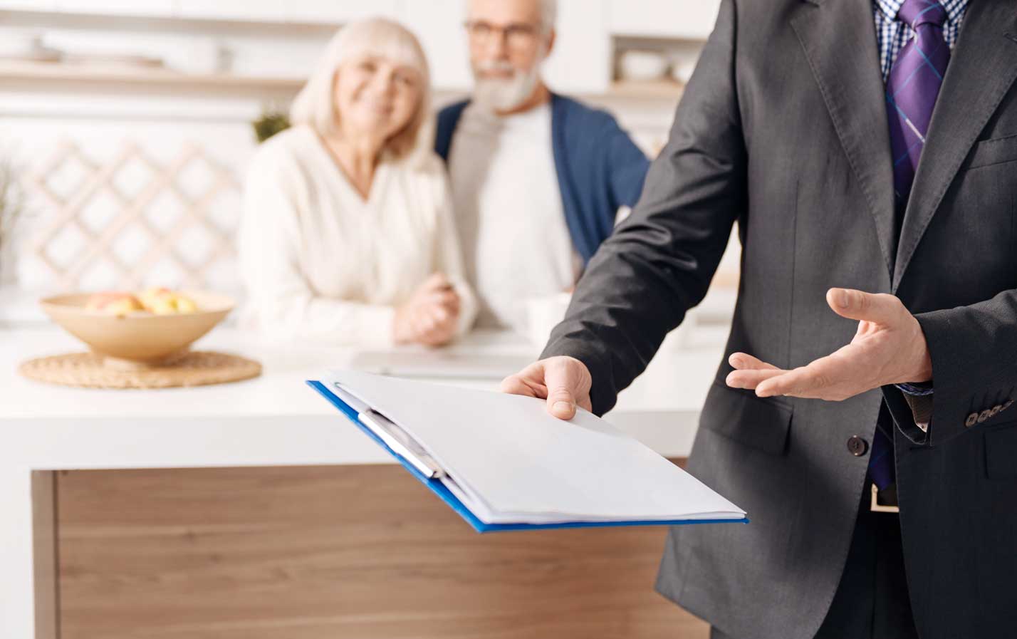 A man holding a clipboard, explaining something.